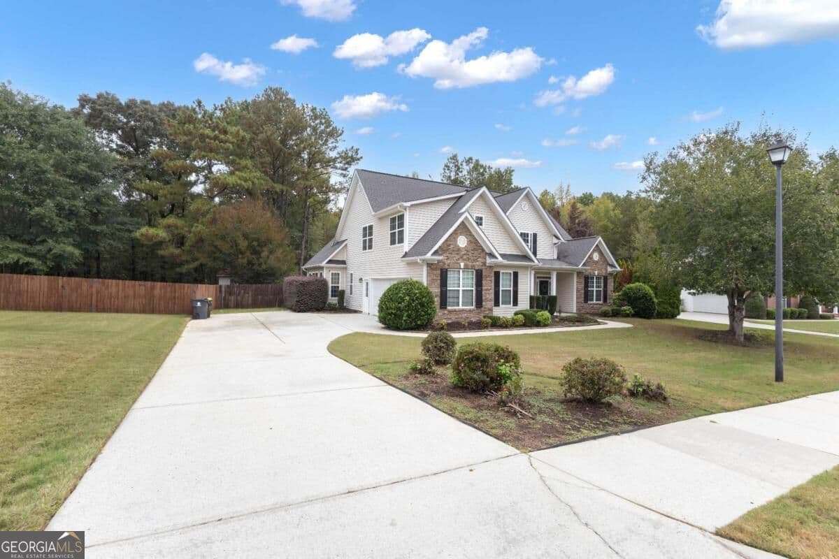 4 bedroom, 3.5 bathroom, 2,936 sq ft single family residence for sale at 241 Otter Circle, Fayetteville, GA 30215 — photo 2