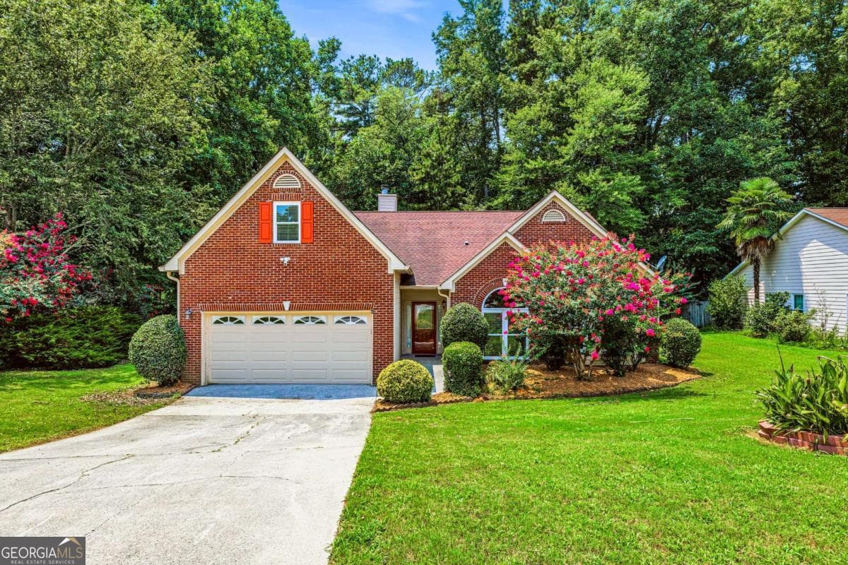4 bedroom, 2 bathroom, 2,612 sq ft single family residence for sale at 1235 Sunhill Drive, Lawrenceville, GA 30043 — photo 1 of 49