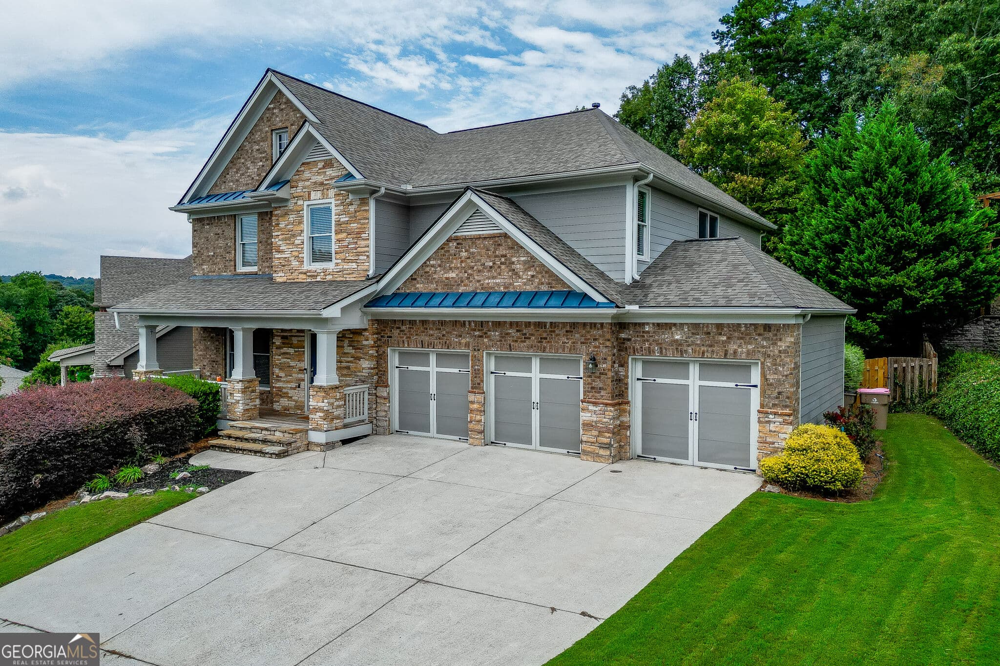 7 bedroom, 6 bathroom, 5,086 sq ft single family residence for sale at 7563 Brookstone Circle, Flowery Branch, GA 30542 — photo 2