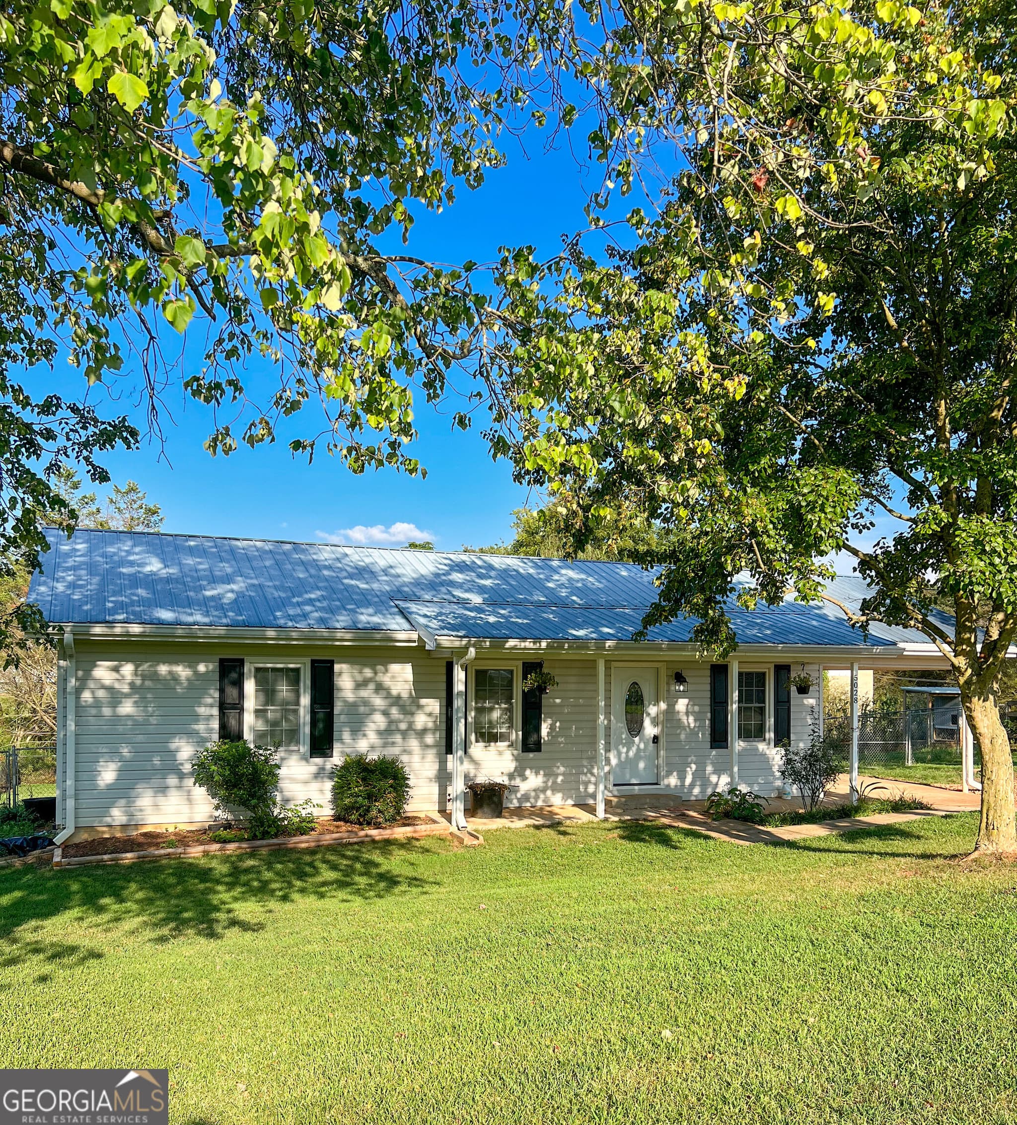 3 bedroom, 2 bathroom, 1,100 sq ft single family residence for sale at 5028 Clarks Bridge Road, Gainesville, GA 30506 — photo 1 of 22