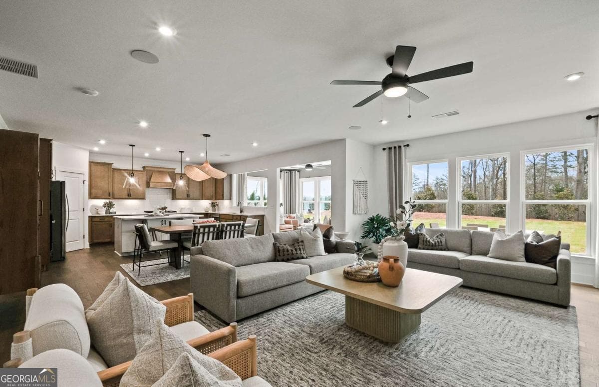 5 bedroom, 3.5 bathroom, 3,554 sq ft single family residence for sale at 7266 Thistle Down Way, Flowery Branch, GA 30542 — photo 4