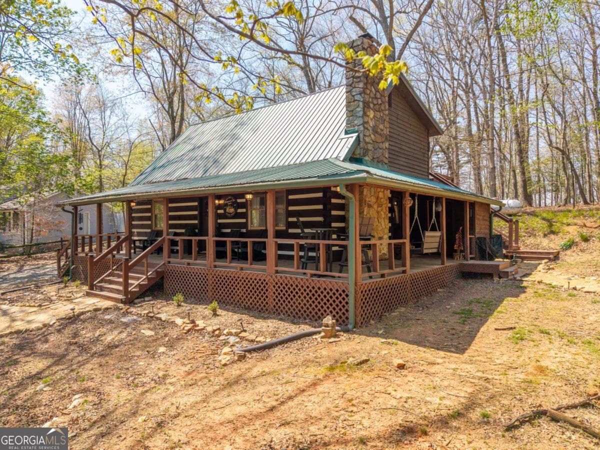 3 bedroom, 1.5 bathroom, 1,458 sq ft cabin,single family residence for sale at 33 Foxhound Drive, Ellijay, GA 30540 — photo 1 of 45