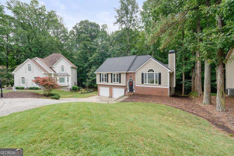 4 bedroom, 3 bathroom, 2,696 sq ft single family residence for sale at 714 Players Court, Woodstock, GA 30189 — photo 2