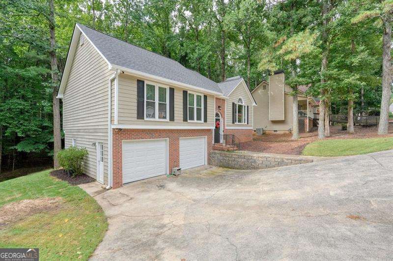 4 bedroom, 3 bathroom, 2,696 sq ft single family residence for sale at 714 Players Court, Woodstock, GA 30189 — photo 3