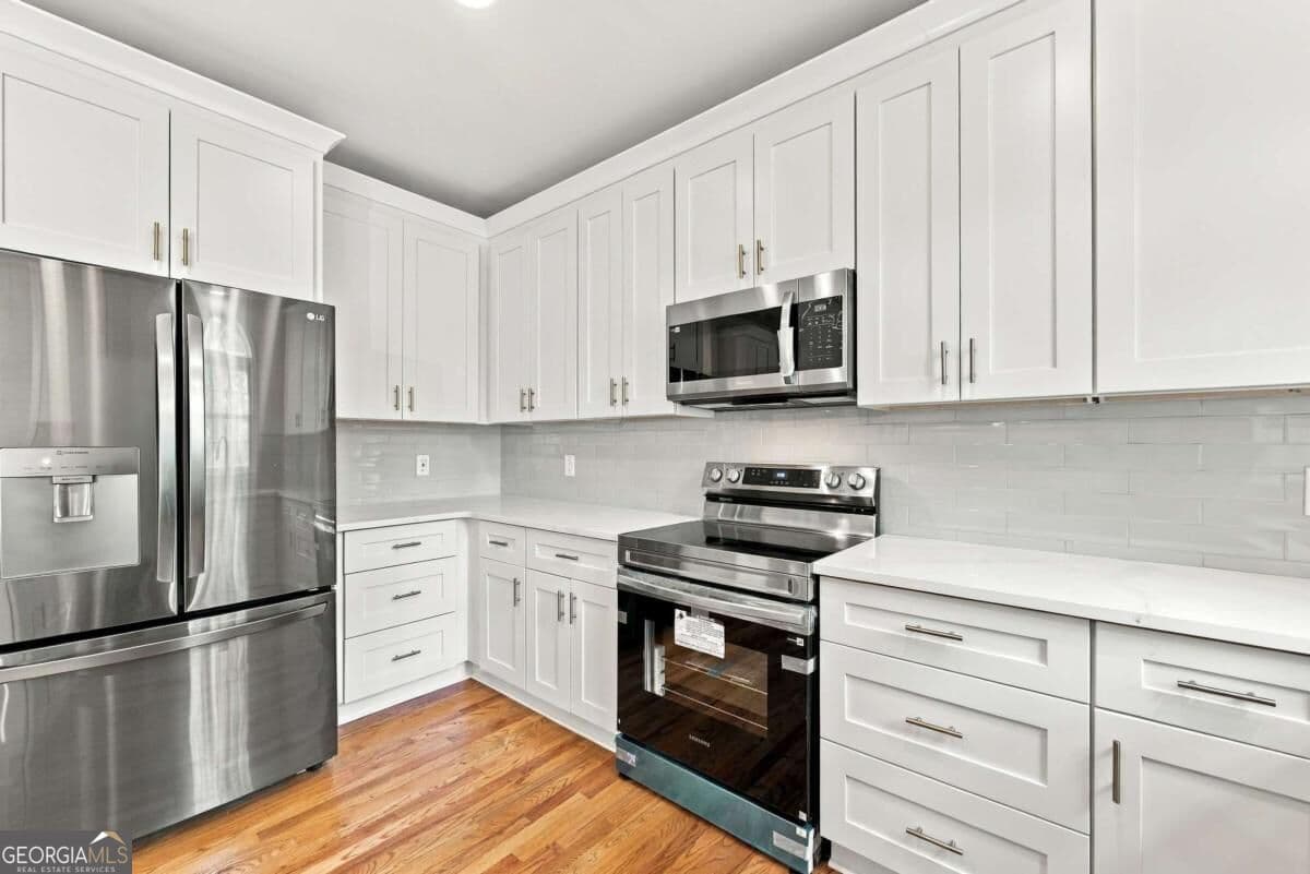 5 bedroom, 3.5 bathroom, 3,409 sq ft single family residence for sale at 437 Connemara Crossing, Lawrenceville, GA 30044 — photo 5