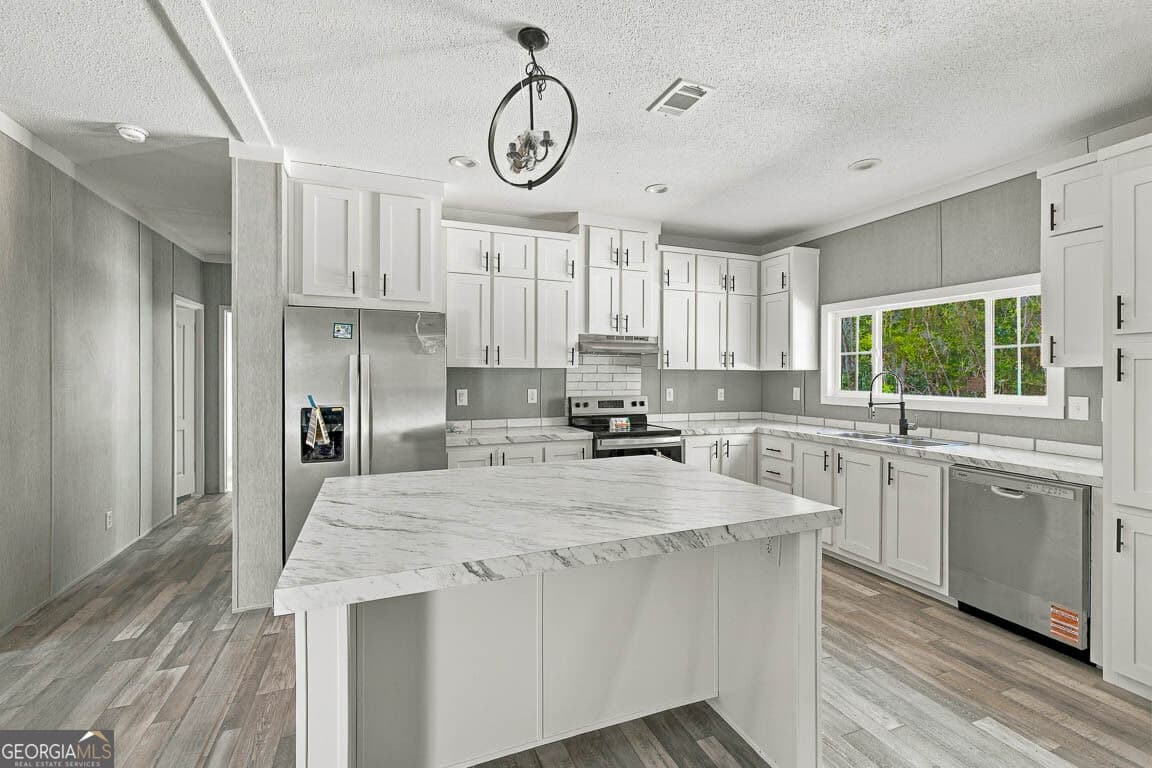 4 bedroom, 2 bathroom, 1,542 sq ft manufactured home,single family residence for sale at 2139 NE Susie Baker Road, Townsend, GA 31331 — photo 3