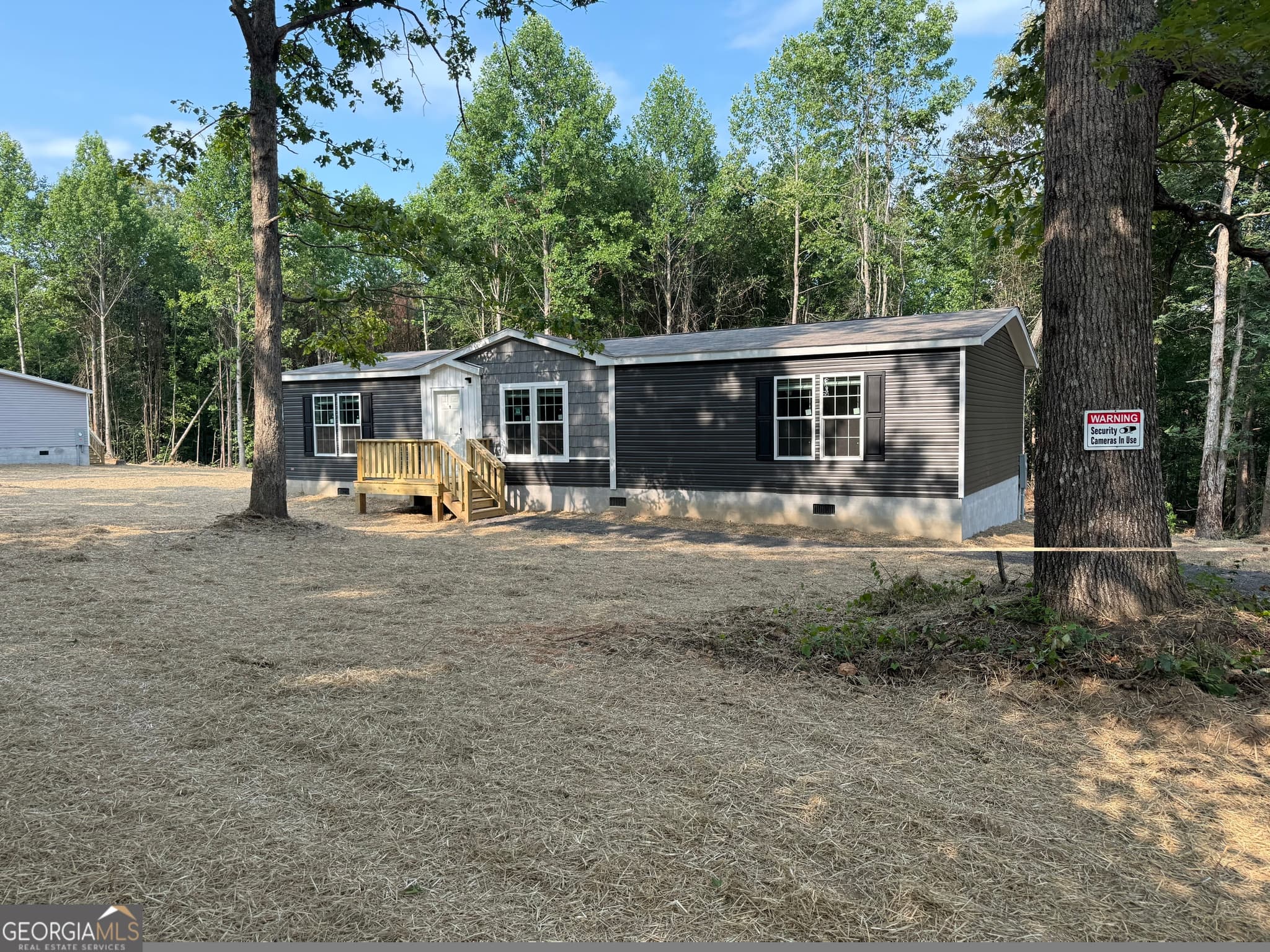 3 bedroom, 2 bathroom, 1,452 sq ft manufactured home,single family residence sold at 911 Harrison Road, Carrollton, GA 30117