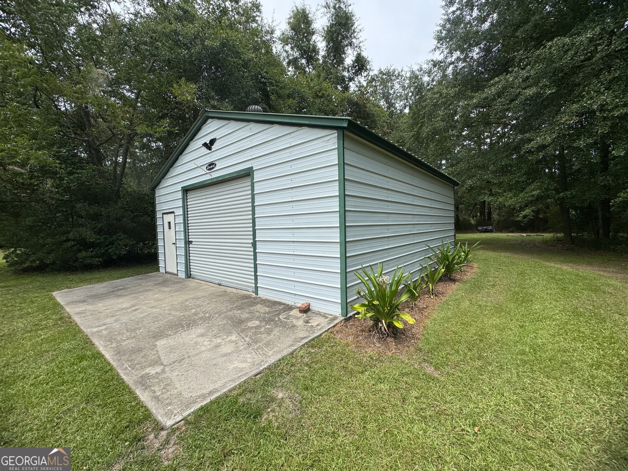 3 bedroom, 2 bathroom, 1,820 sq ft manufactured home,single family residence for sale at 7201 Bowen Road, Twin City, GA 30471 — photo 4
