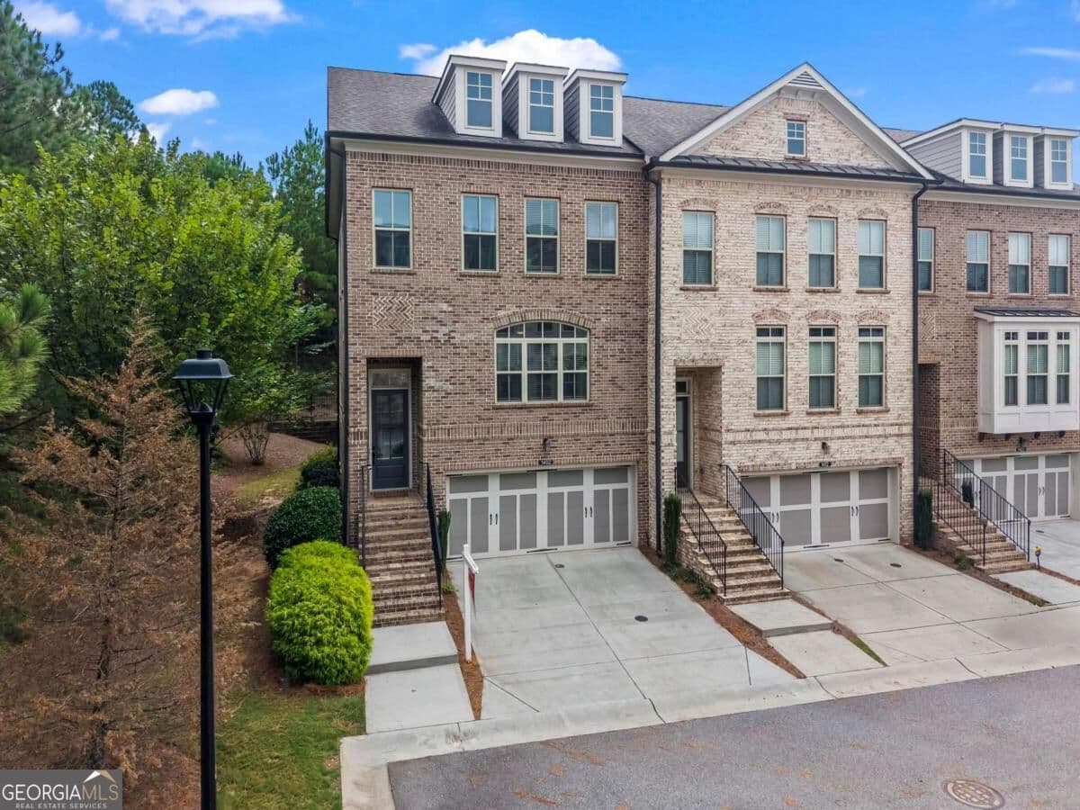 4 bedroom, 3.5 bathroom, 2,302 sq ft townhouse for sale at 1402 Wisteria Wall Drive, Suwanee, GA 30024