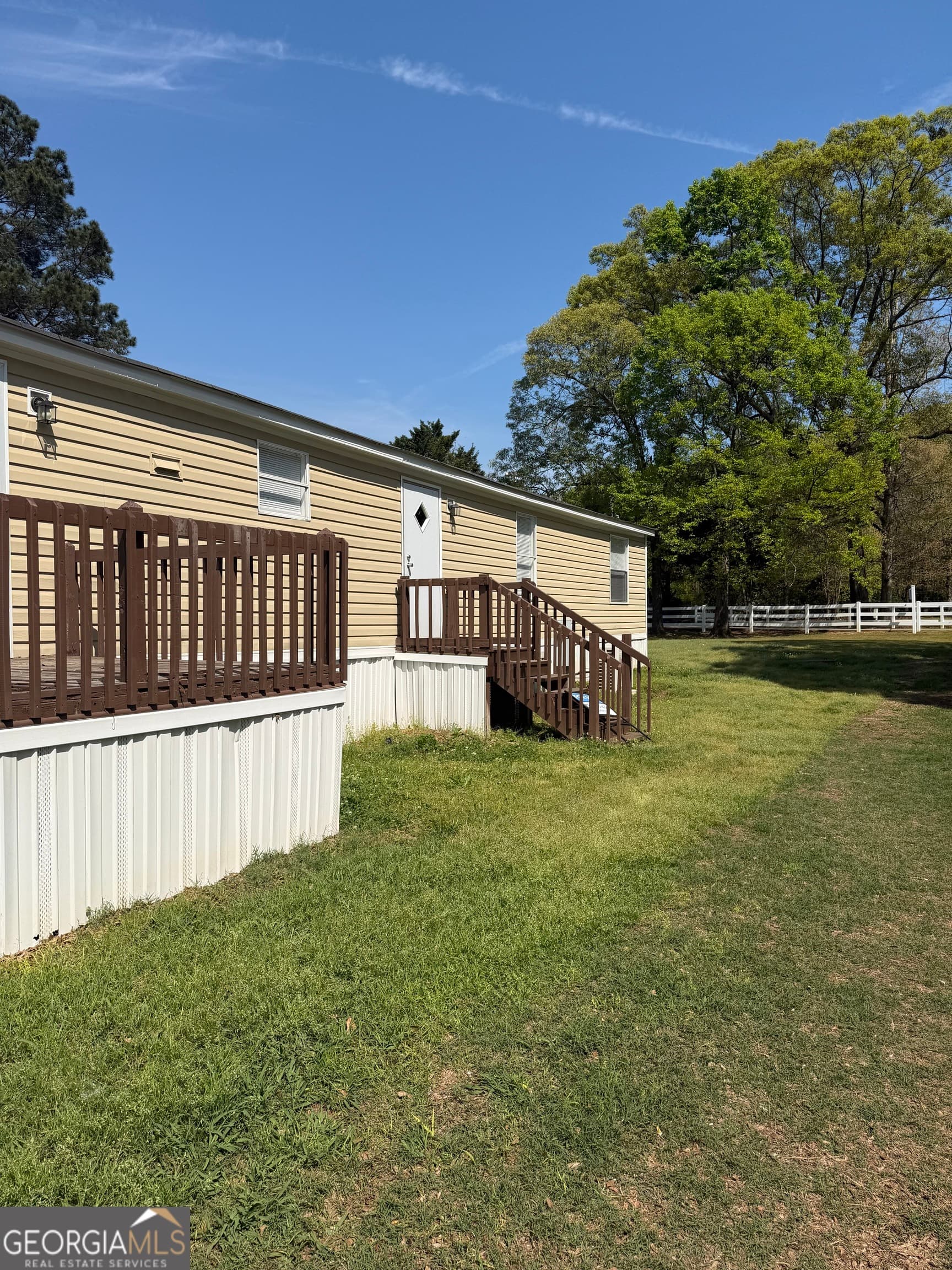 4 bedroom, 2 bathroom manufactured home,single family residence for sale at 405 Windsor Parkway # 405W, Hampton, GA 30228 — photo 2