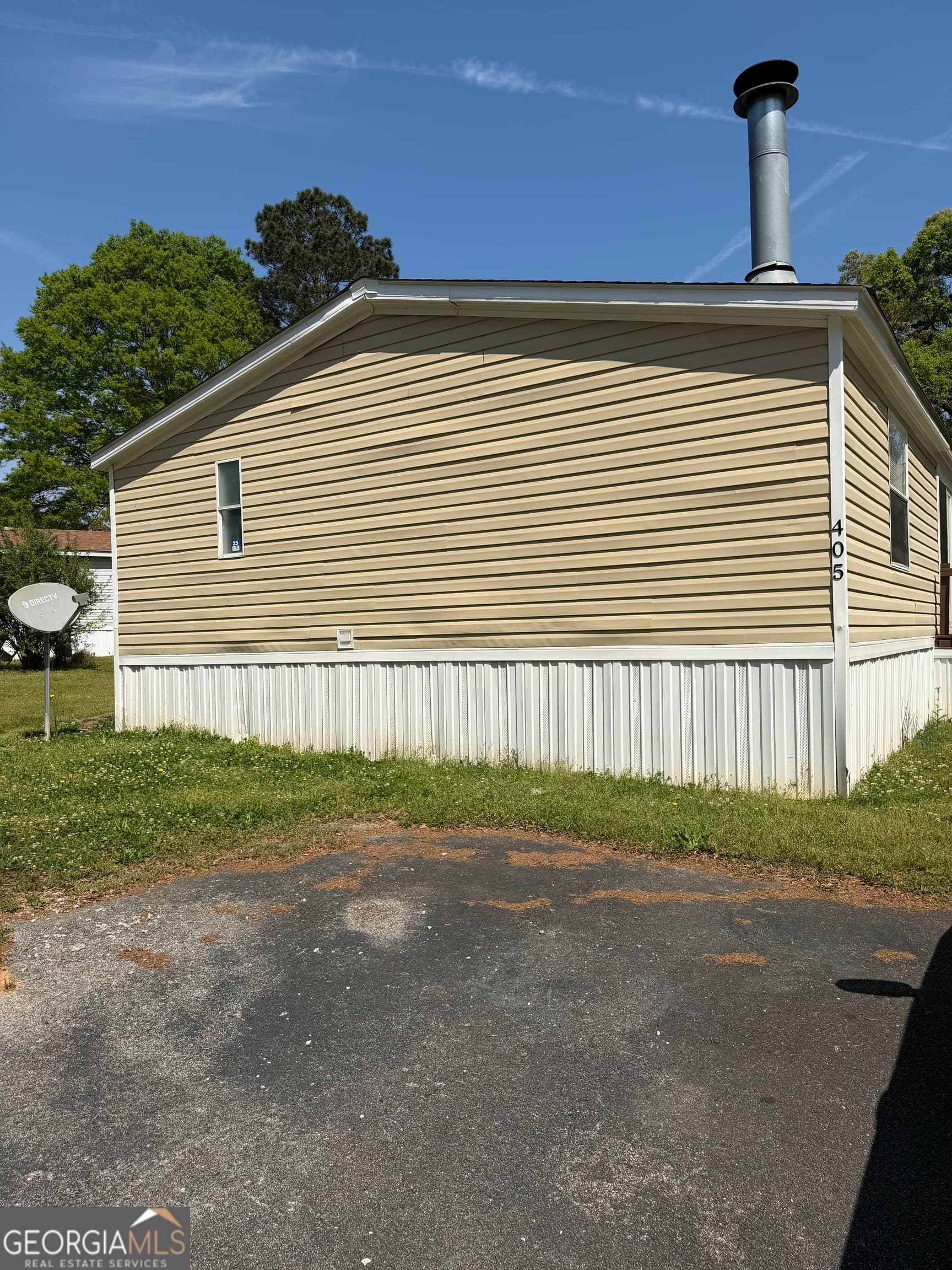 4 bedroom, 2 bathroom manufactured home,single family residence for sale at 405 Windsor Parkway # 405W, Hampton, GA 30228 — photo 3