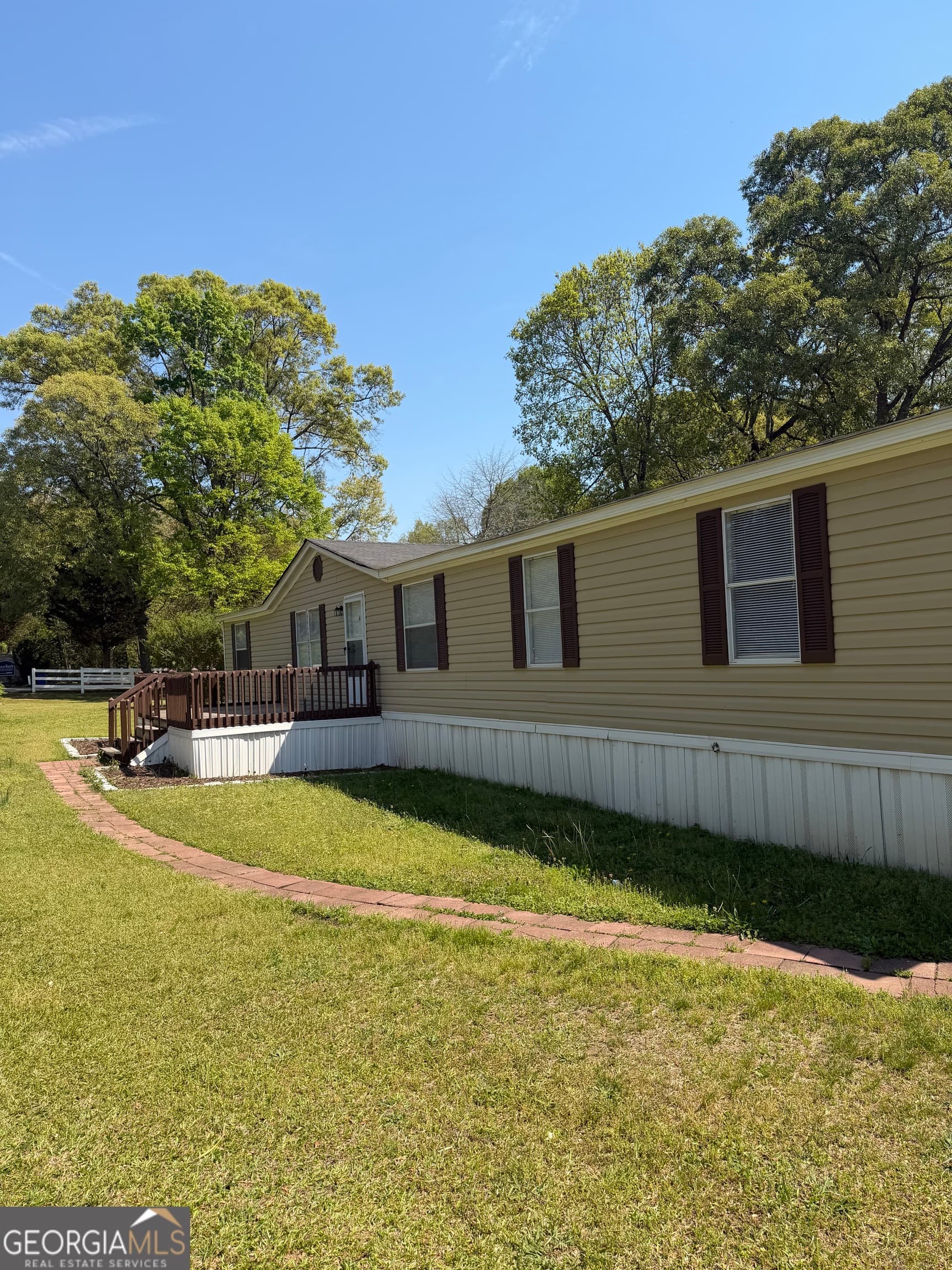 4 bedroom, 2 bathroom manufactured home,single family residence for sale at 405 Windsor Parkway # 405W, Hampton, GA 30228 — photo 4