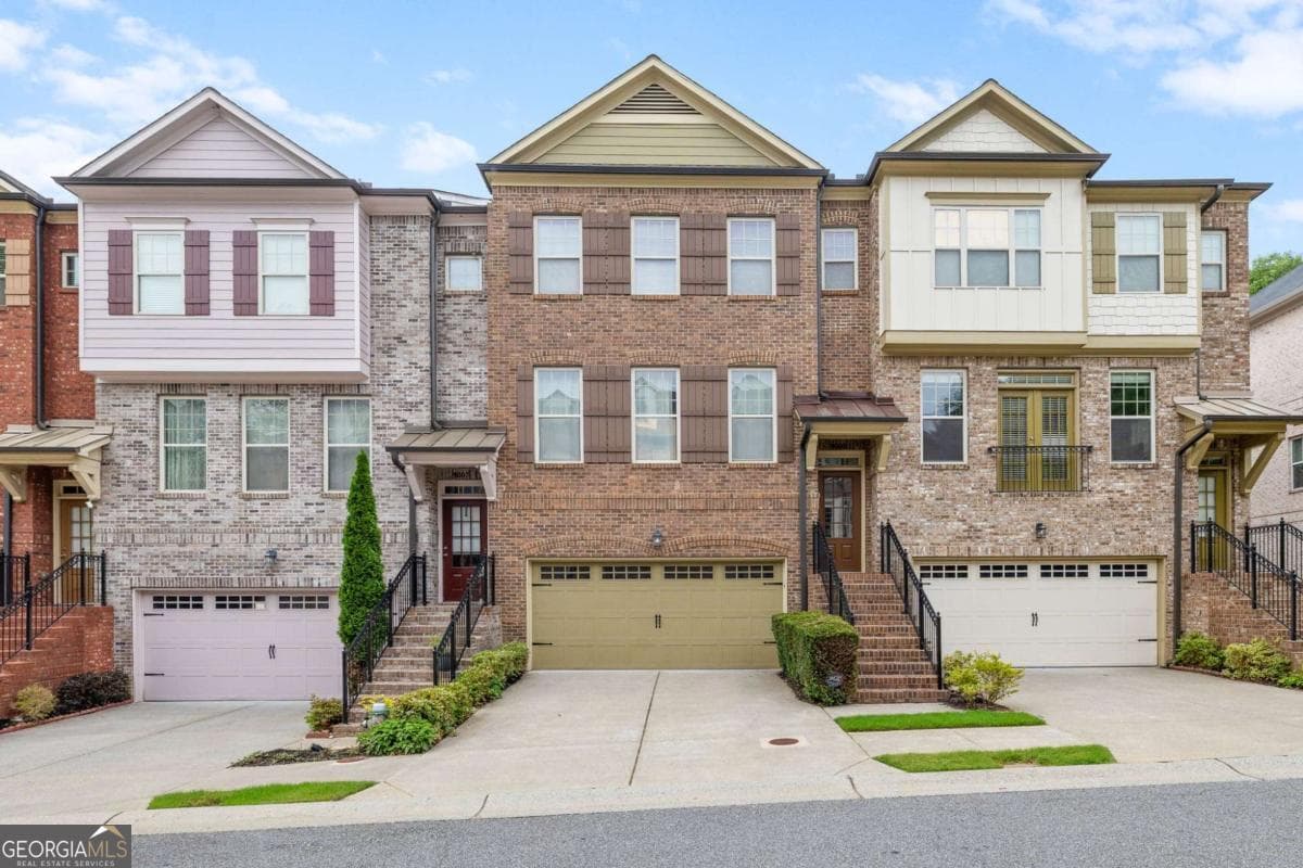 4 bedroom, 3.5 bathroom, 2,624 sq ft townhouse for sale at 9009 Woodland Trail, Alpharetta, GA 30009 — photo 1 of 42