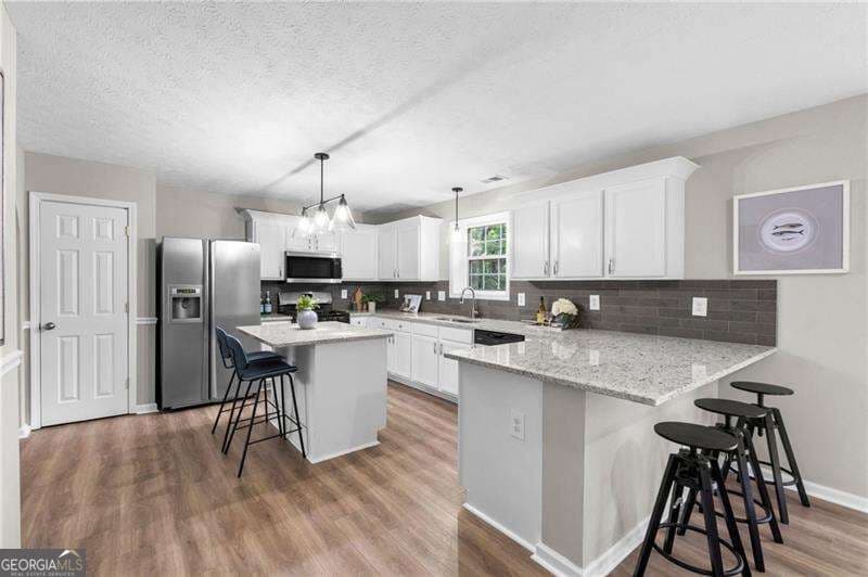 6 bedroom, 3.5 bathroom, 3,876 sq ft single family residence for sale at 5077 Newpark Drive, Acworth, GA 30101 — photo 5