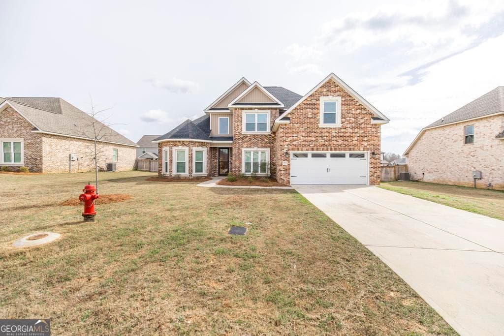 5 bedroom, 3 bathroom, 2,418 sq ft single family residence for sale at 613 Jeffery Thomas Drive, Bonaire, GA 31005 — photo 2