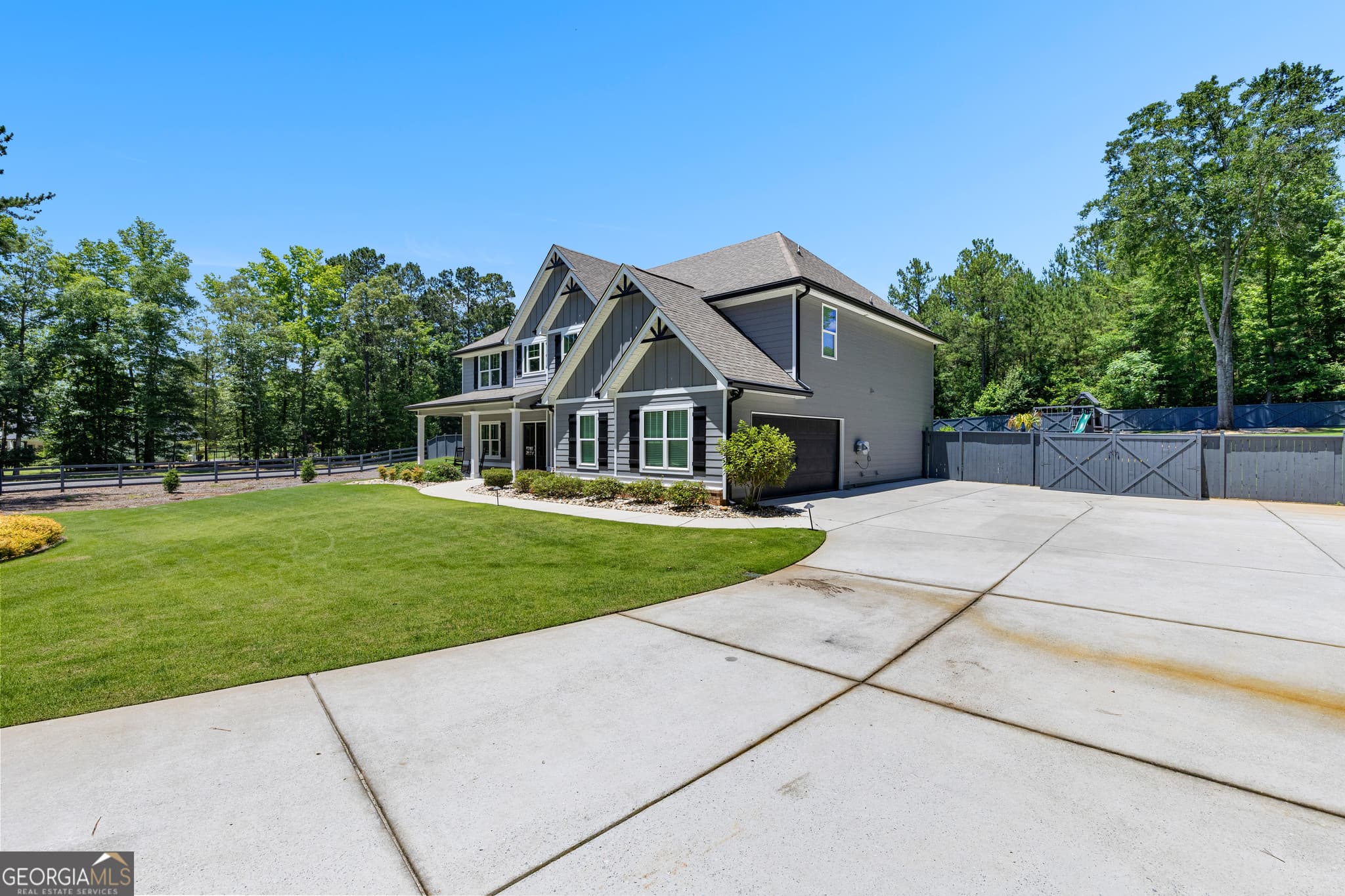 5 bedroom, 4 bathroom, 6,128 sq ft single family residence for sale at 878 McIntosh Trail, Sharpsburg, GA 30277 — photo 2