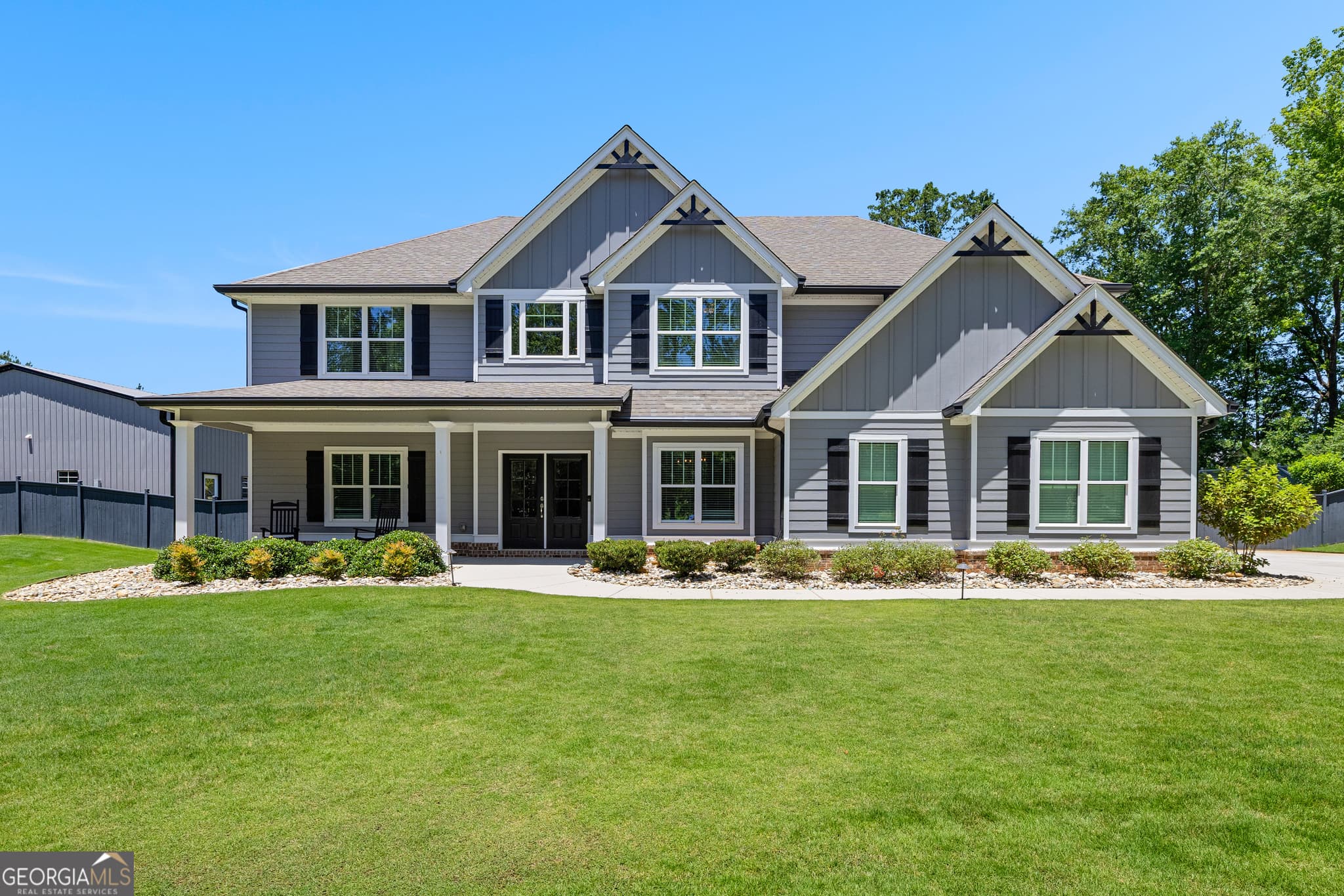 5 bedroom, 4 bathroom, 6,128 sq ft single family residence for sale at 878 McIntosh Trail, Sharpsburg, GA 30277 — photo 1 of 89