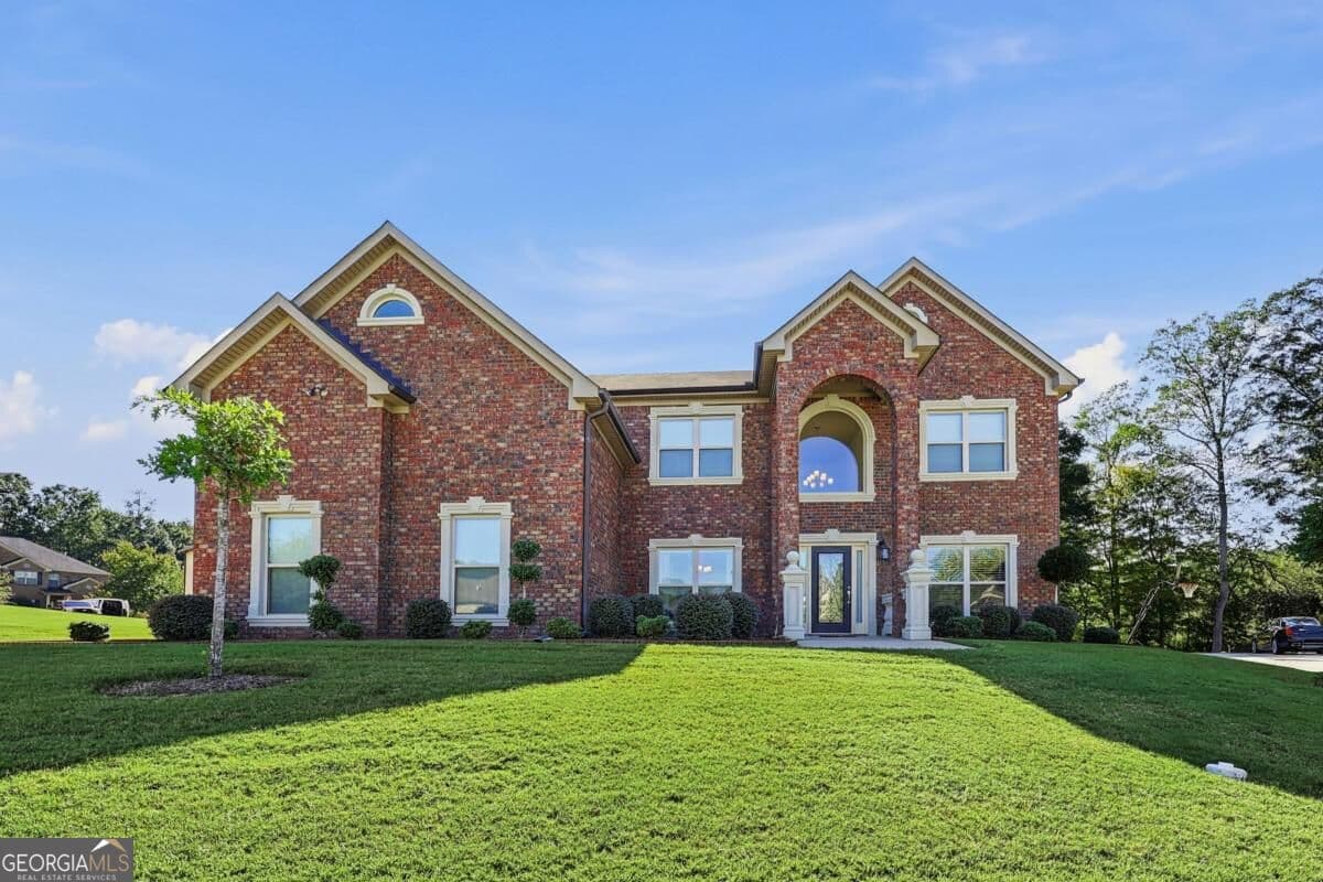 5 bedroom, 4 bathroom single family residence for sale at 7447 Winterberry Trace, Conyers, GA 30094 — photo 2