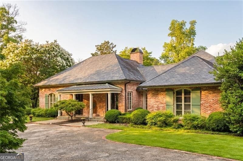 6 bedroom, 5 bathroom, 6,327 sq ft single family residence for sale at 10180 Capps Ferry Road, Chattahoochee Hills, GA 30268 — photo 2