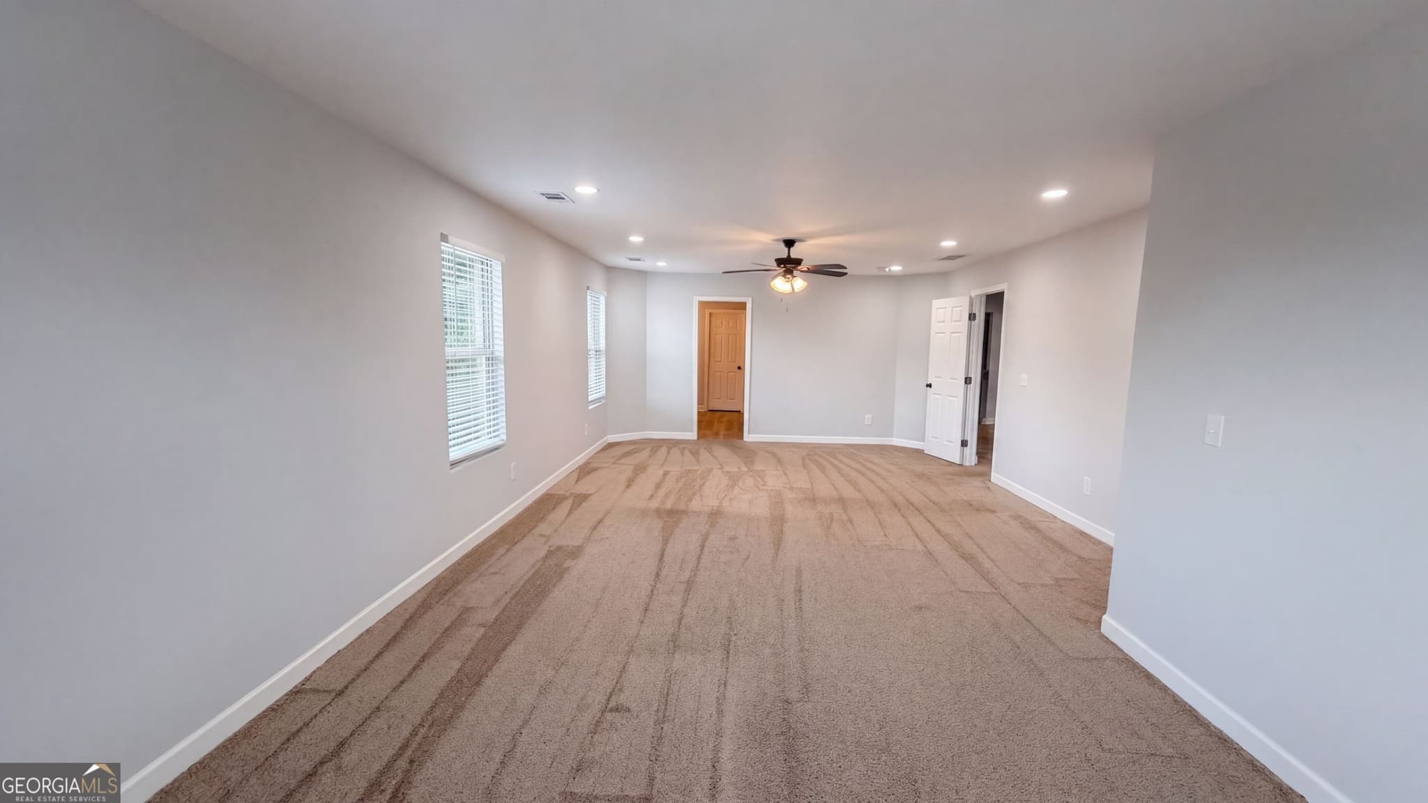 6 bedroom, 4.5 bathroom, 4,879 sq ft single family residence for sale at 321 Basel Way, Hampton, GA 30228 — photo 4
