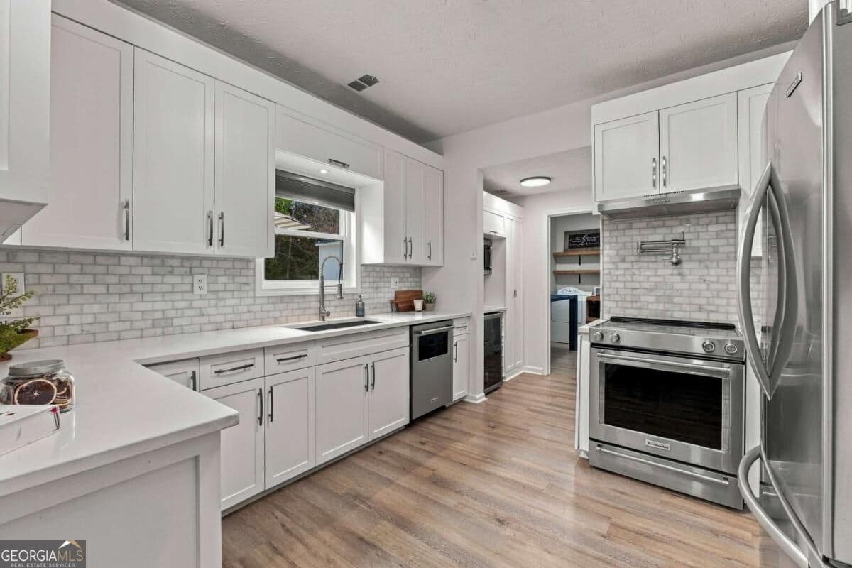 4 bedroom, 2.5 bathroom, 2,340 sq ft single family residence for sale at 3400 Duncan Bridge Drive, Buford, GA 30519 — photo 3