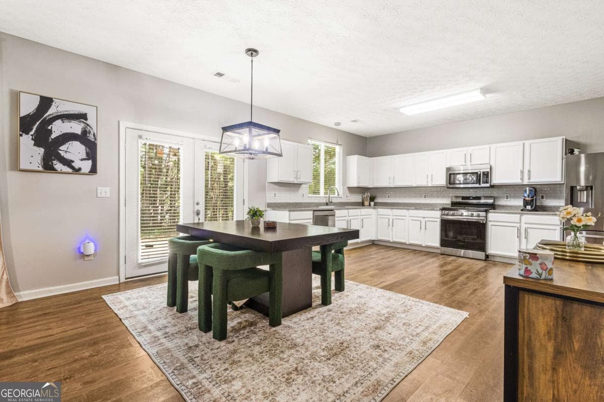 4 bedroom, 2.5 bathroom, 2,166 sq ft single family residence for sale at 3187 Sable Run Road, Atlanta, GA 30349 — photo 4