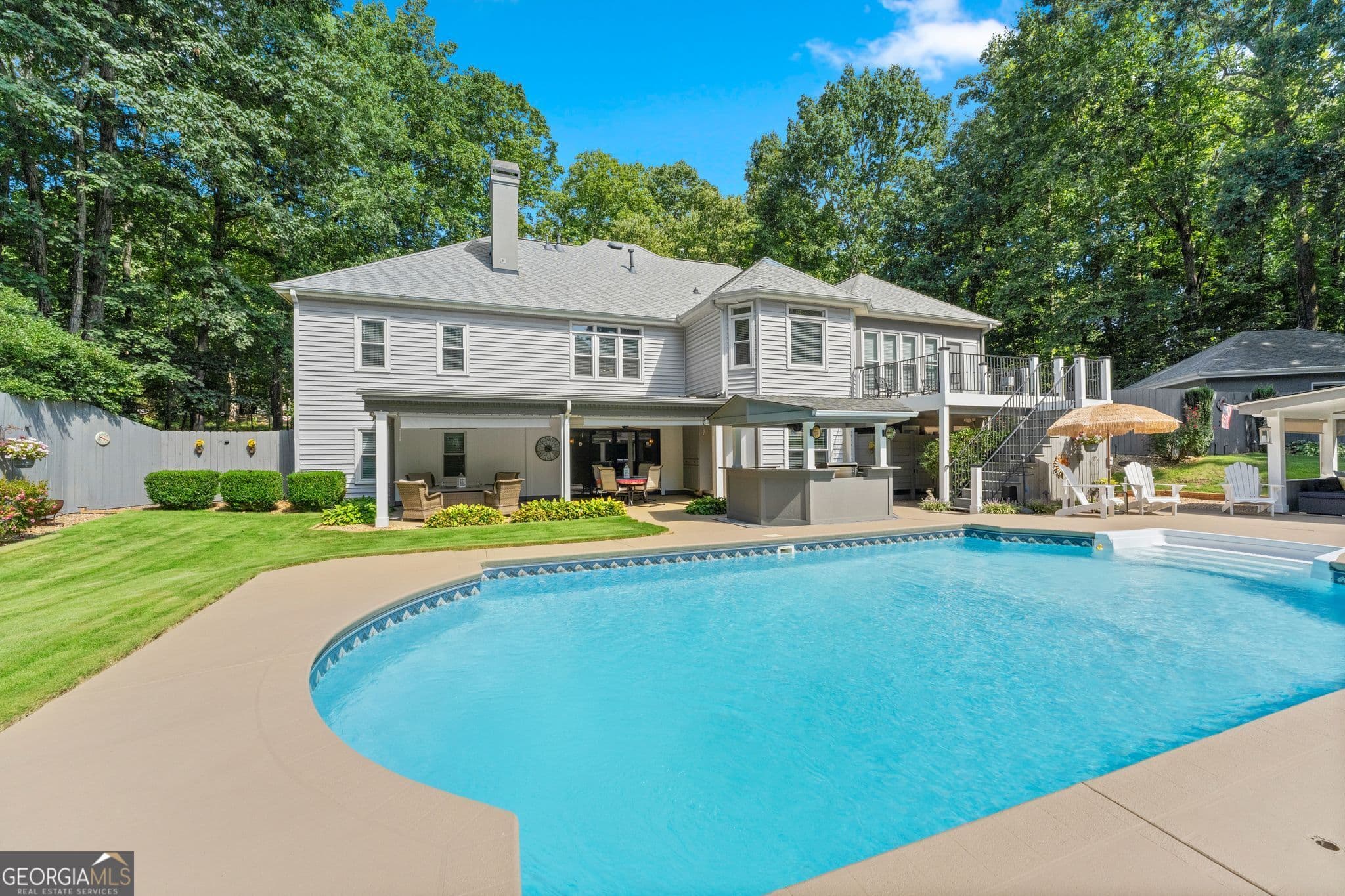 6 bedroom, 4.5 bathroom, 4,622 sq ft single family residence for sale at 5725 Ash Drive, Cumming, GA 30040 — photo 2