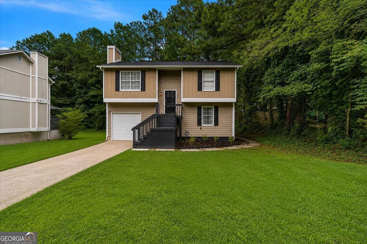 3 bedroom, 2 bathroom, 1,324 sq ft single family residence for sale at 5300 Forest Downs Lane, Atlanta, GA 30349 — photo 2