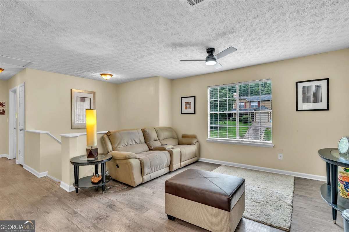 3 bedroom, 2 bathroom, 1,324 sq ft single family residence for sale at 5300 Forest Downs Lane, Atlanta, GA 30349 — photo 3