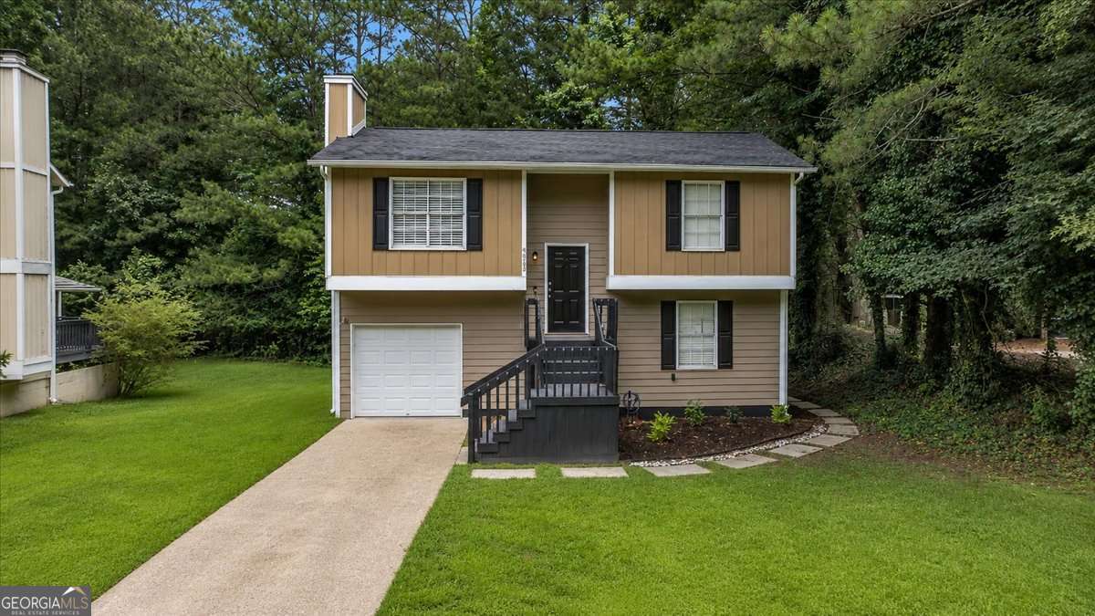 3 bedroom, 2 bathroom, 1,324 sq ft single family residence for sale at 5300 Forest Downs Lane, Atlanta, GA 30349 — photo 1 of 24