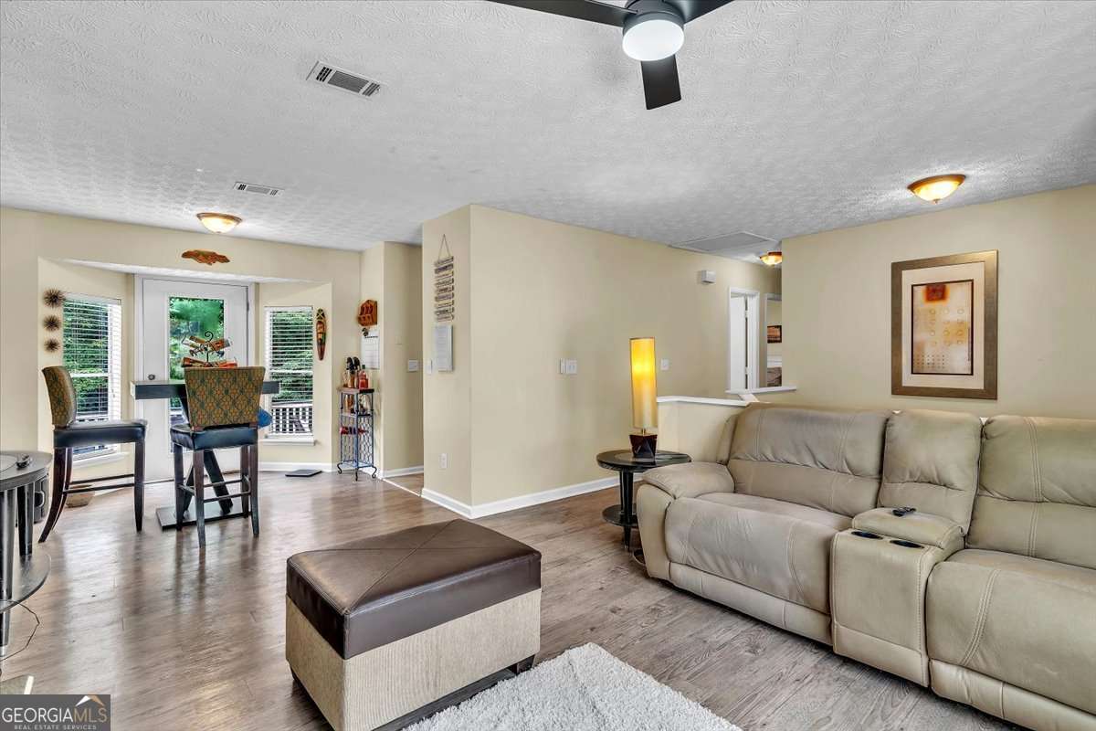 3 bedroom, 2 bathroom, 1,324 sq ft single family residence for sale at 5300 Forest Downs Lane, Atlanta, GA 30349 — photo 5