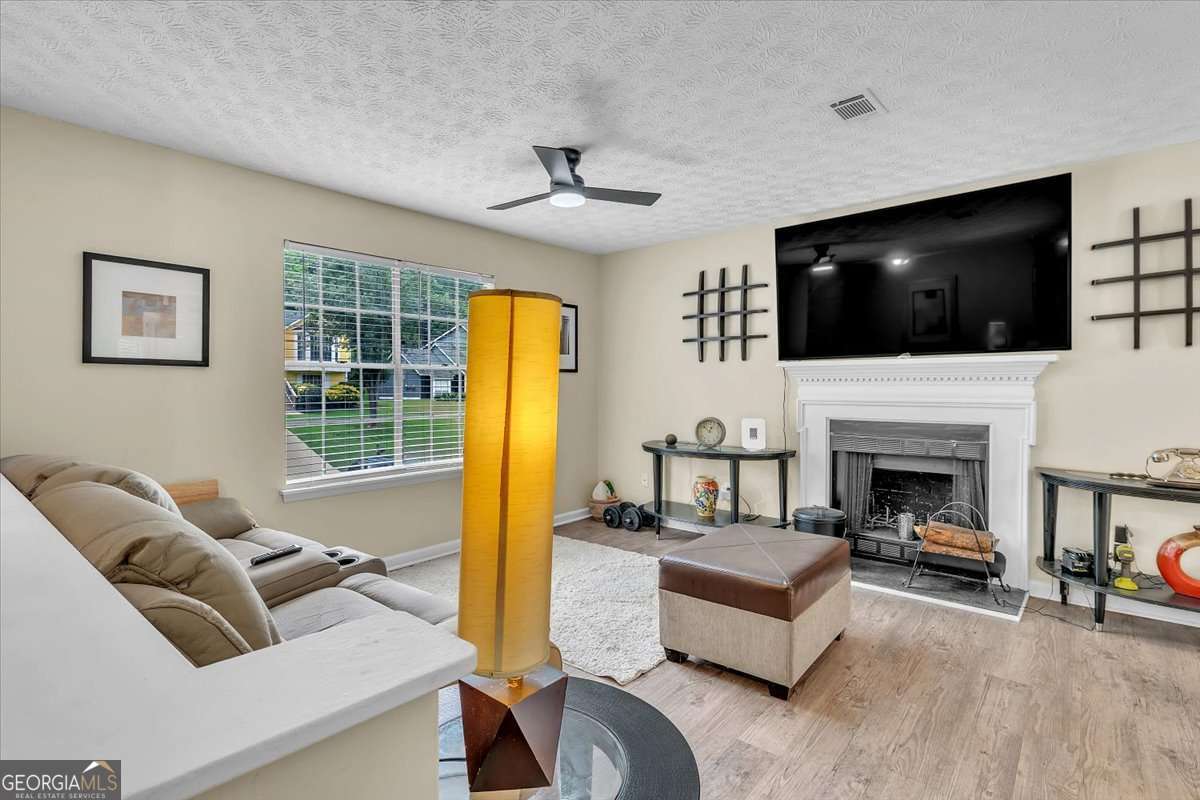 3 bedroom, 2 bathroom, 1,324 sq ft single family residence for sale at 5300 Forest Downs Lane, Atlanta, GA 30349 — photo 4