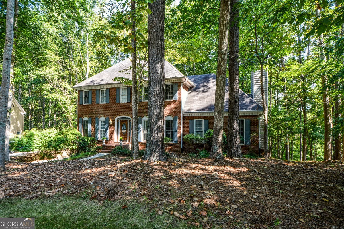 4 bedroom, 3 bathroom, 3,380 sq ft single family residence for sale at 3515 Stone Cliff Way, Woodstock, GA 30189 — photo 2