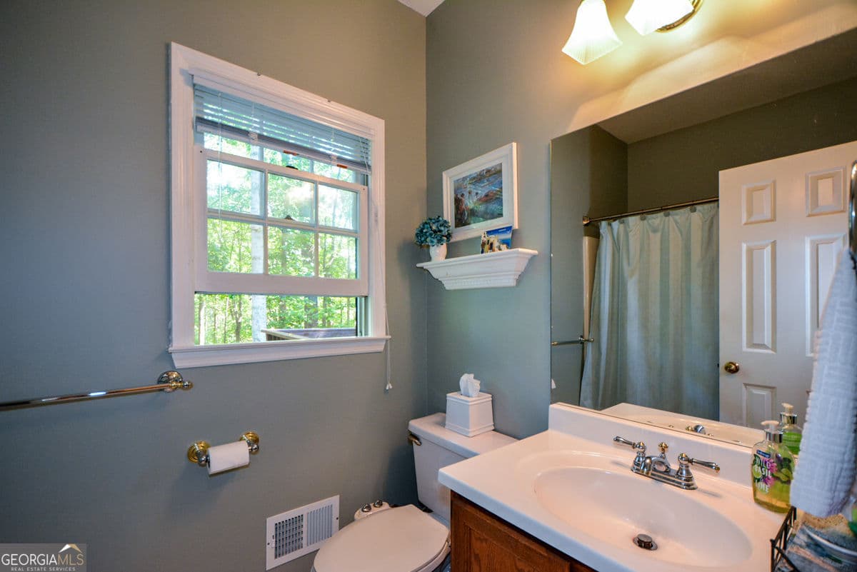 4 bedroom, 3 bathroom, 3,380 sq ft single family residence for sale at 3515 Stone Cliff Way, Woodstock, GA 30189 — photo 9