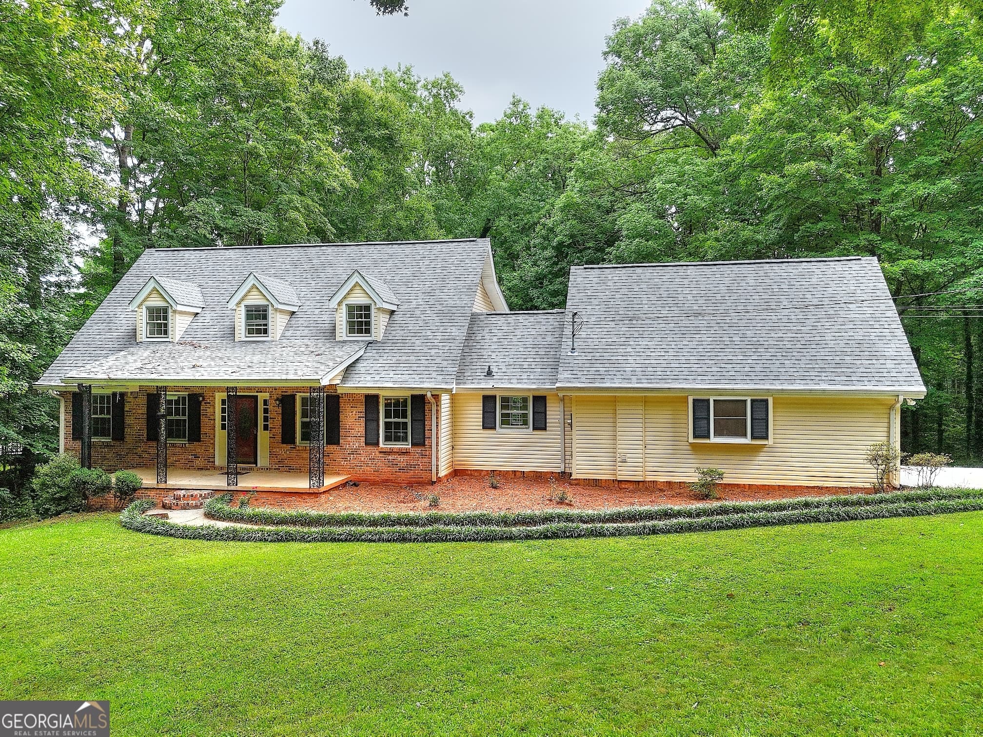 5 bedroom, 3.5 bathroom, 3,882 sq ft single family residence for sale at 66 SW Lockring Drive, Lilburn, GA 30047 — photo 1 of 35