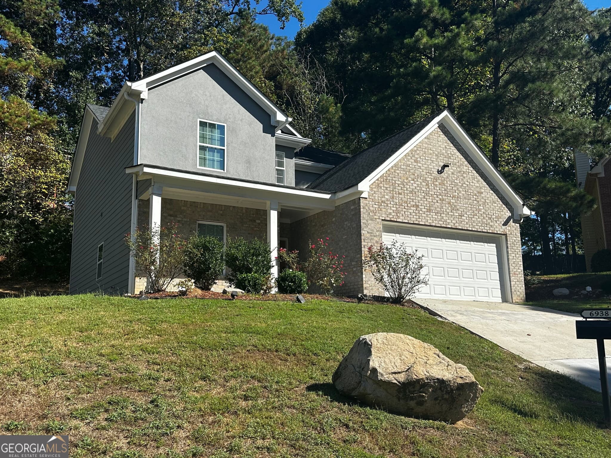 4 bedroom, 3.5 bathroom, 2,036 sq ft single family residence for sale at 6938 Shadow Ridge Lane, Stone Mountain, GA 30087 — photo 1 of 18