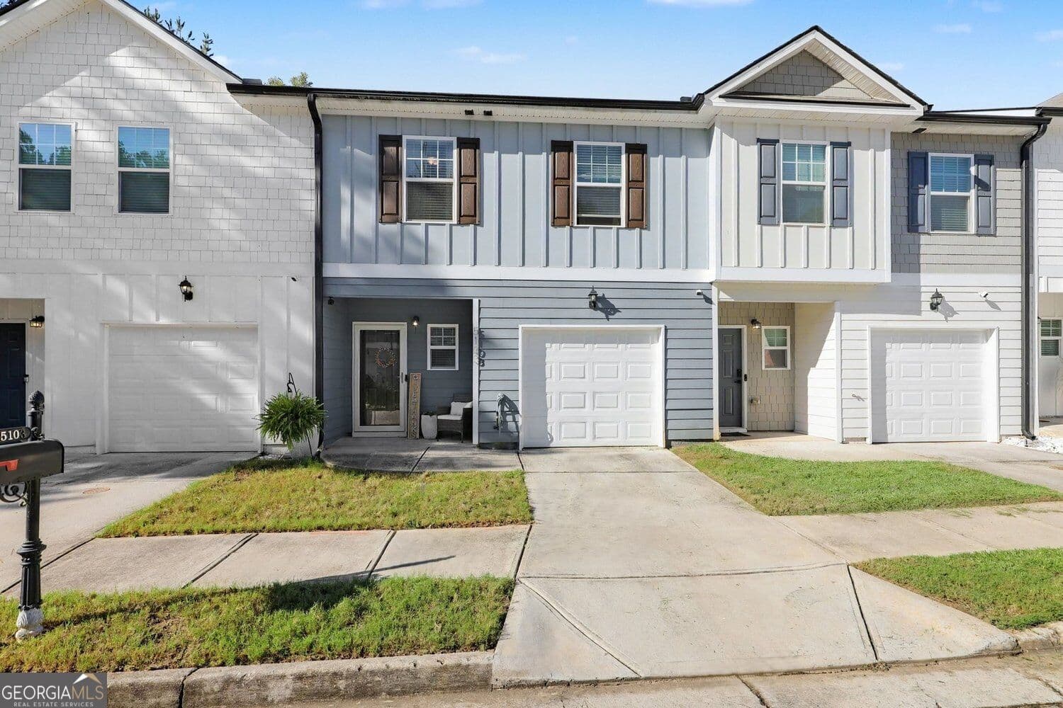 3 bedroom, 2.5 bathroom, 1,880 sq ft townhouse for sale at 5103 Lower Elm Street, Atlanta, GA 30349 — photo 1 of 33