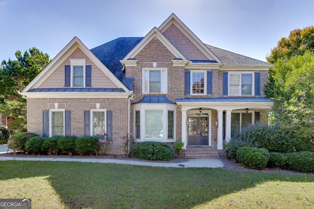 6 bedroom, 5 bathroom, 4,995 sq ft single family residence for sale at 7708 Sleepy Lagoon Way, Flowery Branch, GA 30542 — photo 1 of 59