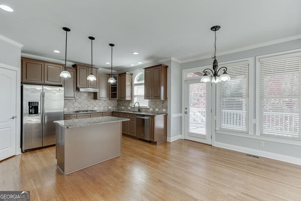 6 bedroom, 5 bathroom, 4,995 sq ft single family residence for sale at 7708 Sleepy Lagoon Way, Flowery Branch, GA 30542 — photo 10