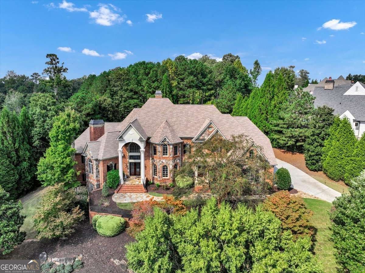 7 bedroom, 6 bathroom, 10,800 sq ft single family residence for sale at 3124 Watsons Bend, Milton, GA 30004 — photo 2