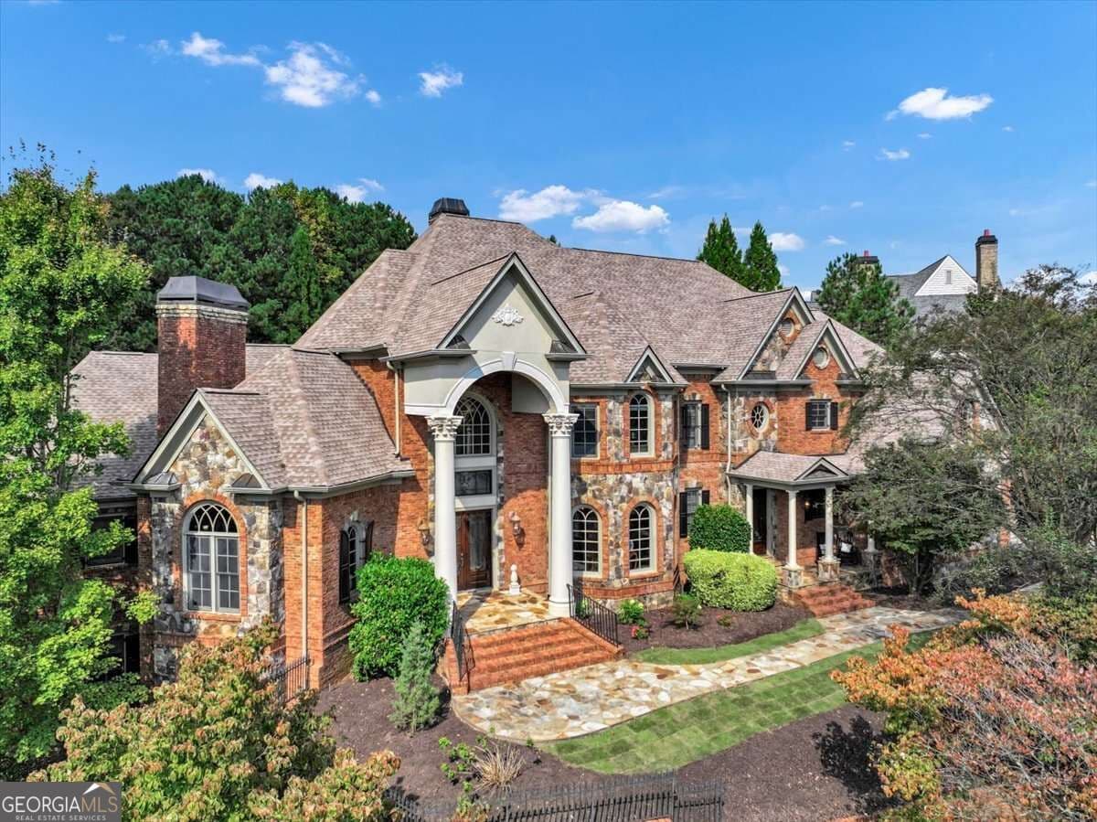 7 bedroom, 6 bathroom, 10,800 sq ft single family residence for sale at 3124 Watsons Bend, Milton, GA 30004 — photo 7