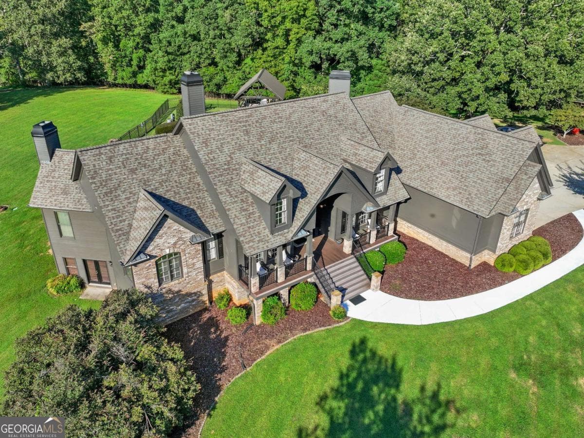 5 bedroom, 3.5 bathroom, 6,513 sq ft single family residence for sale at 5846 Conner Road, Flowery Branch, GA 30542 — photo 2