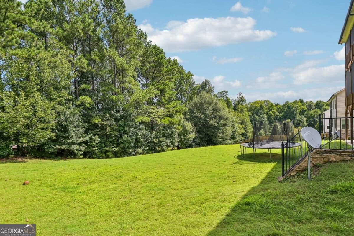 6 bedroom, 5.5 bathroom, 5,149 sq ft single family residence for sale at 606 Taymack, Woodstock, GA 30188 — photo 8