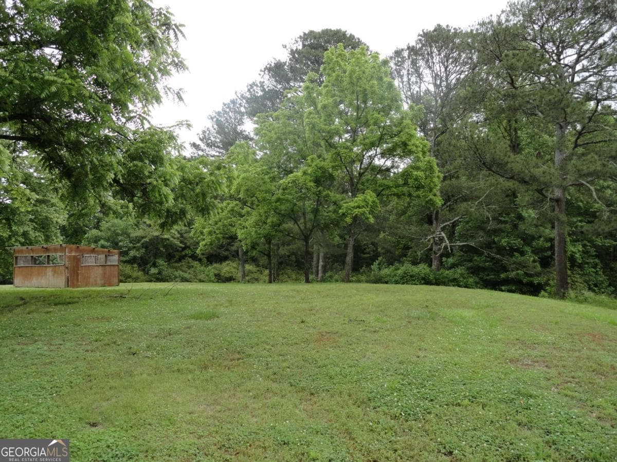 unimproved land for sale at 8664 Cumming Highway, Canton, GA 30115 — photo 7