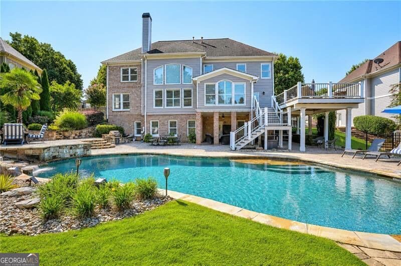 6 bedroom, 5.5 bathroom, 6,782 sq ft single family residence for sale at 1043 Meadow Club Court, Suwanee, GA 30024 — photo 2