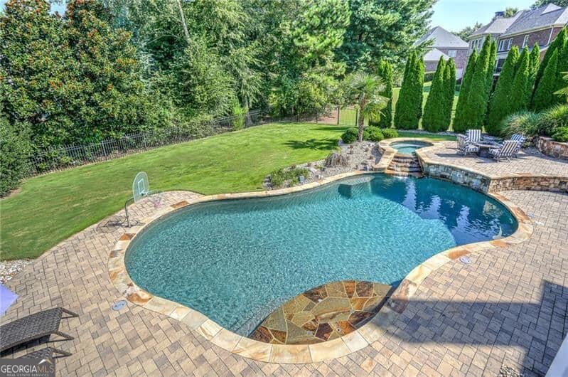 6 bedroom, 5.5 bathroom, 6,782 sq ft single family residence for sale at 1043 Meadow Club Court, Suwanee, GA 30024 — photo 3