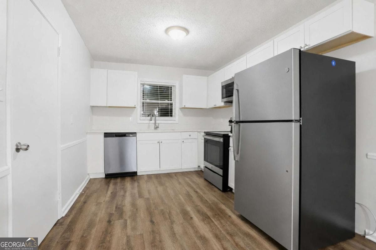 4 bedroom, 2.5 bathroom, 1,740 sq ft single family residence for sale at 3896 Rux Road, Atlanta, GA 30331 — photo 6