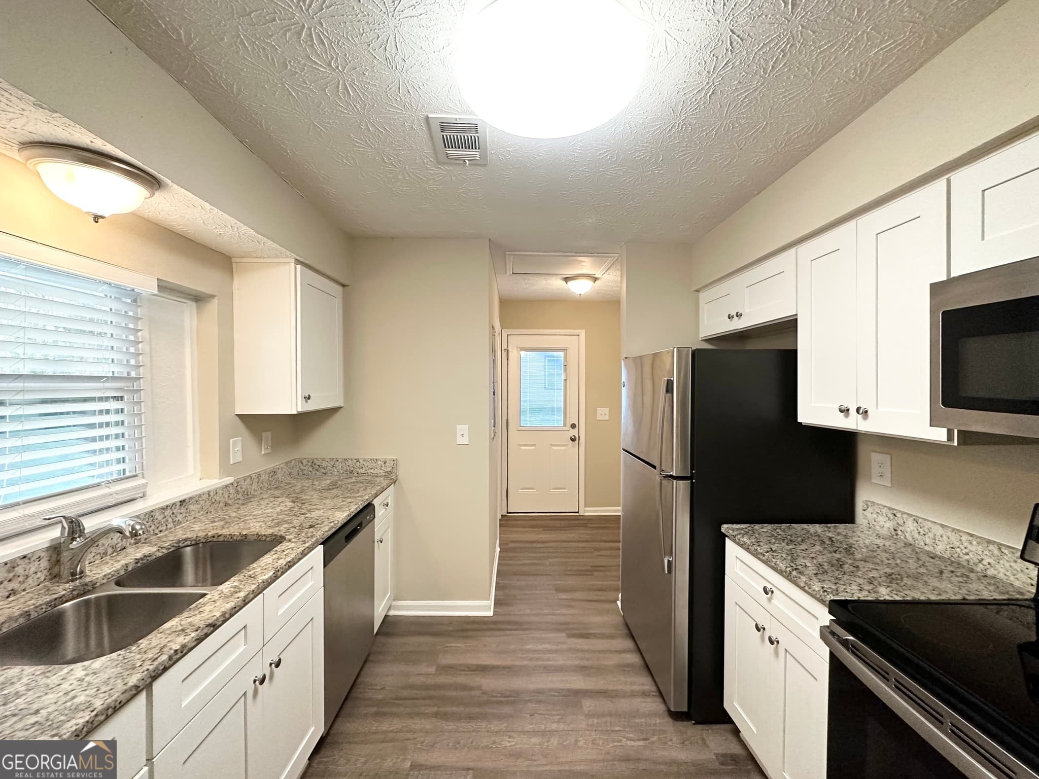 4 bedroom, 1.5 bathroom, 1,406 sq ft single family residence for sale at 4864 Brookstone Parkway, Ellenwood, GA 30294 — photo 5