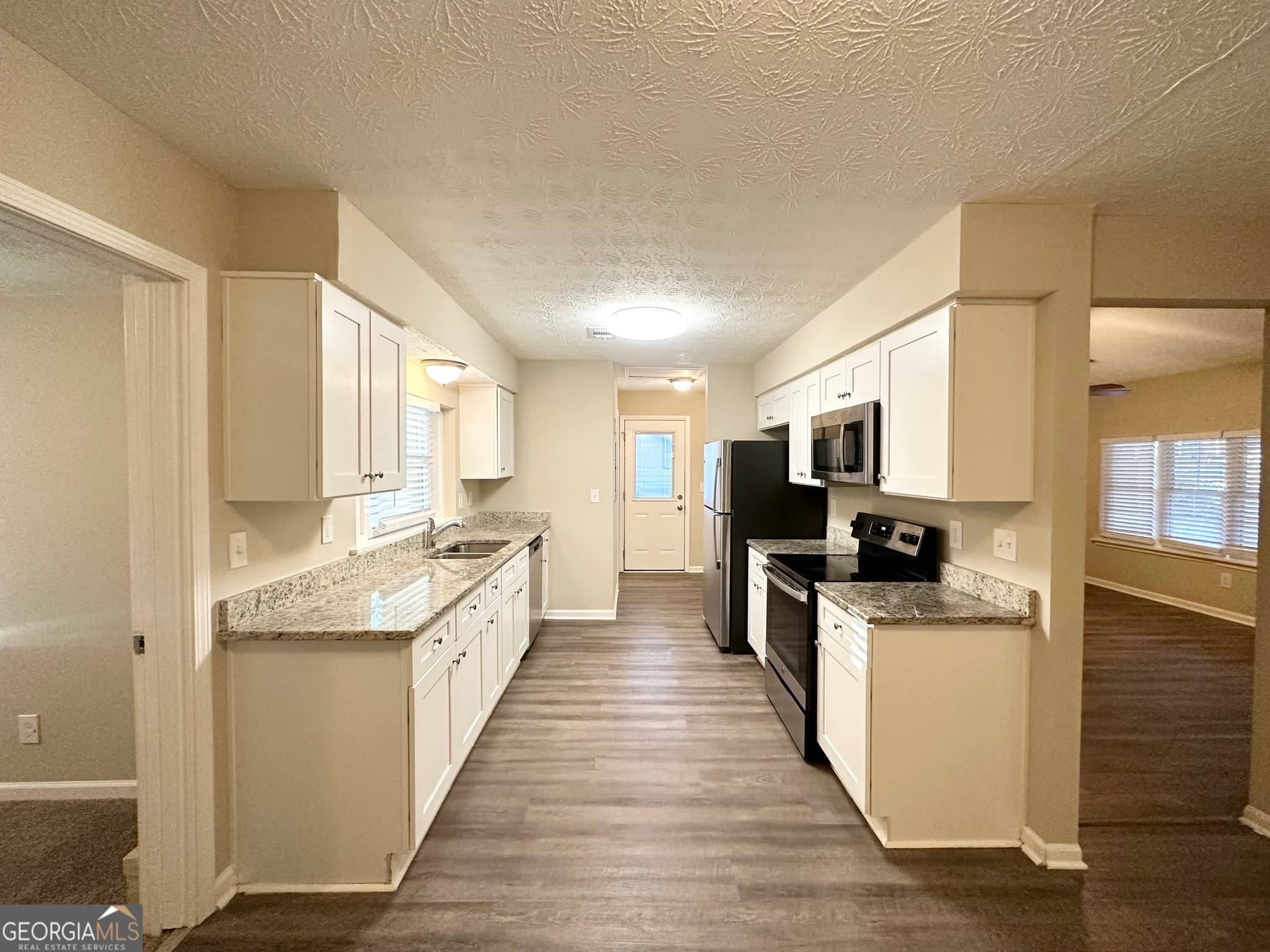 4 bedroom, 1.5 bathroom, 1,406 sq ft single family residence for sale at 4864 Brookstone Parkway, Ellenwood, GA 30294 — photo 4