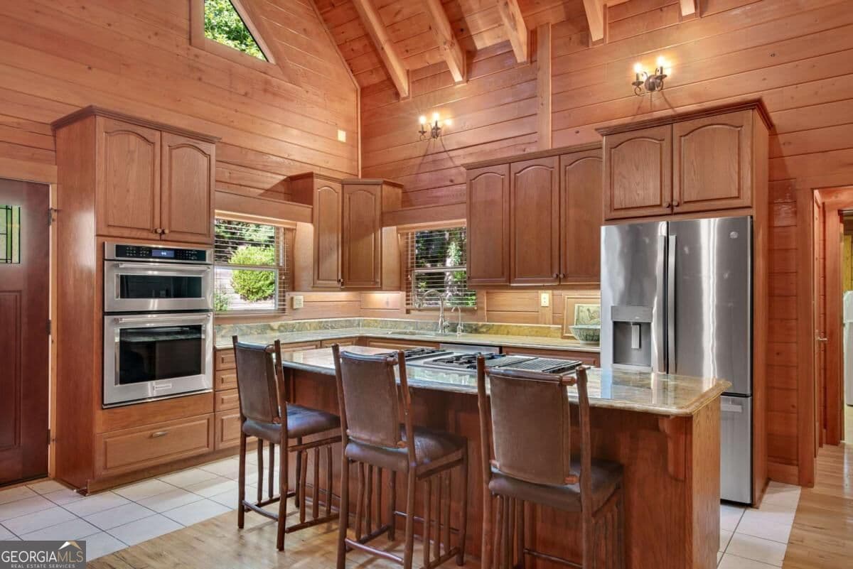 5 bedroom, 5.5 bathroom, 4,510 sq ft cabin,single family residence for sale at 1300 Soap Creek Road, Ball Ground, GA 30107 — photo 7